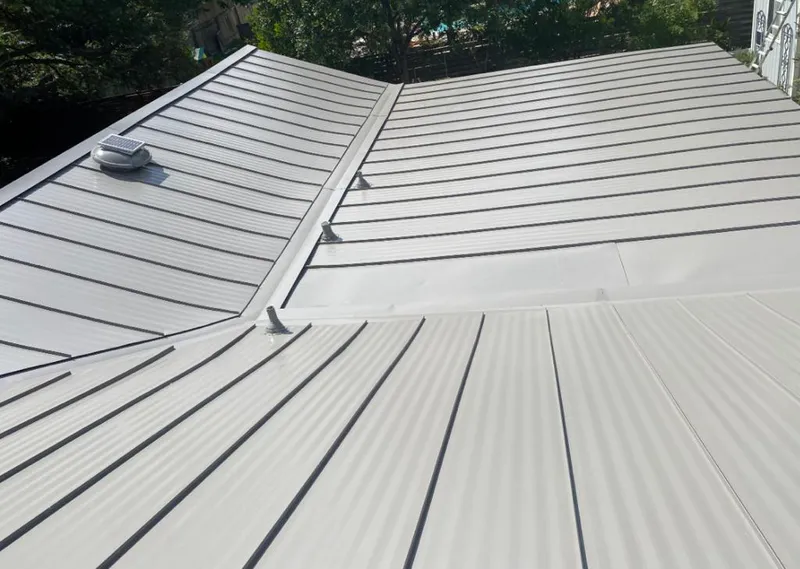 Solar attic fan installed on a metal roof for Roof Ventilation in Lake Morton-Berrydale